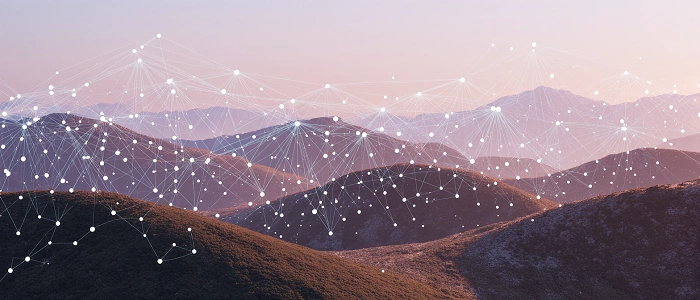 Abstraktní propojení bodů nad krajinou symbolizující geocachingové statistiky, mapy a sledování pokroku